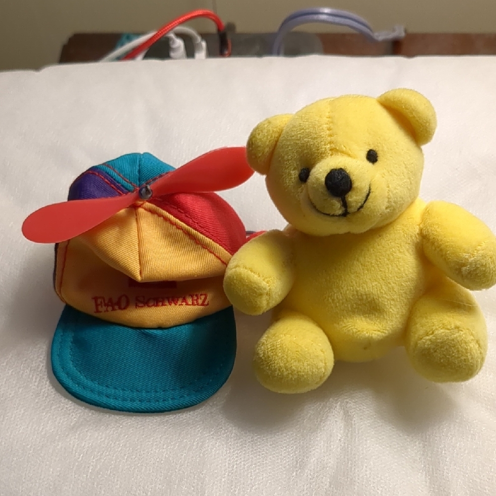 vintage key rings: FAO Schwarz  Colorful Propeller Hat and a yellow bear